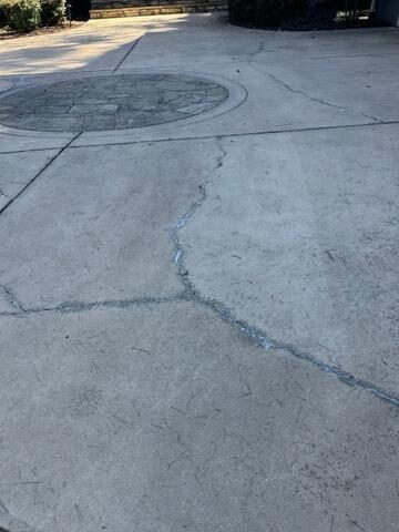 Before photo of driveway concrete crack